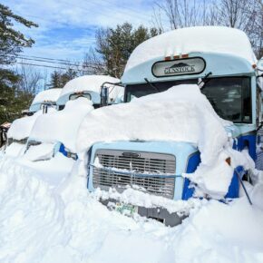 Gunstock bus covered in snow